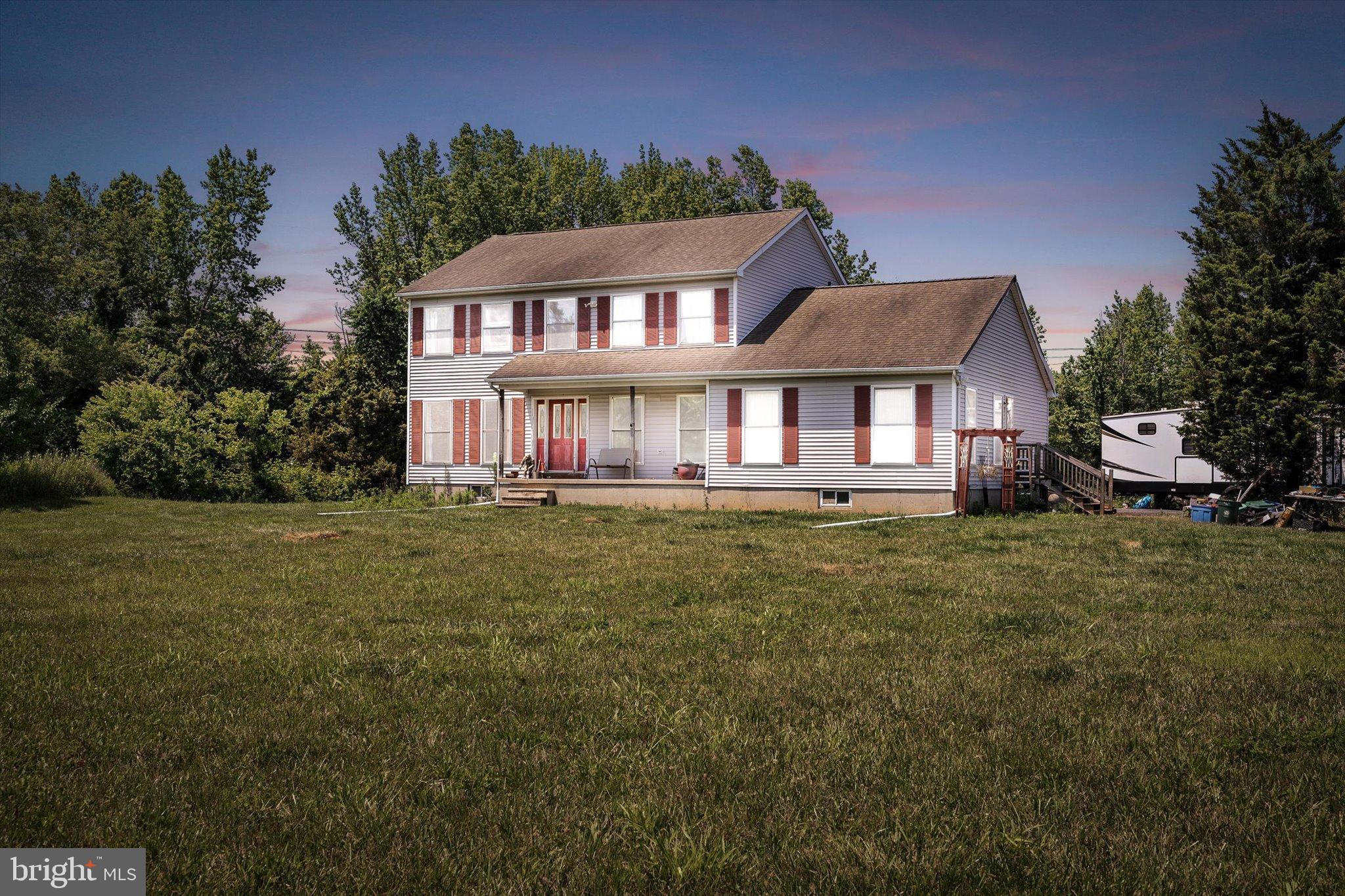 36 Allens Road Hightstown, NJ 08520 - Photo 1 of 43 a front view of a house with a garden