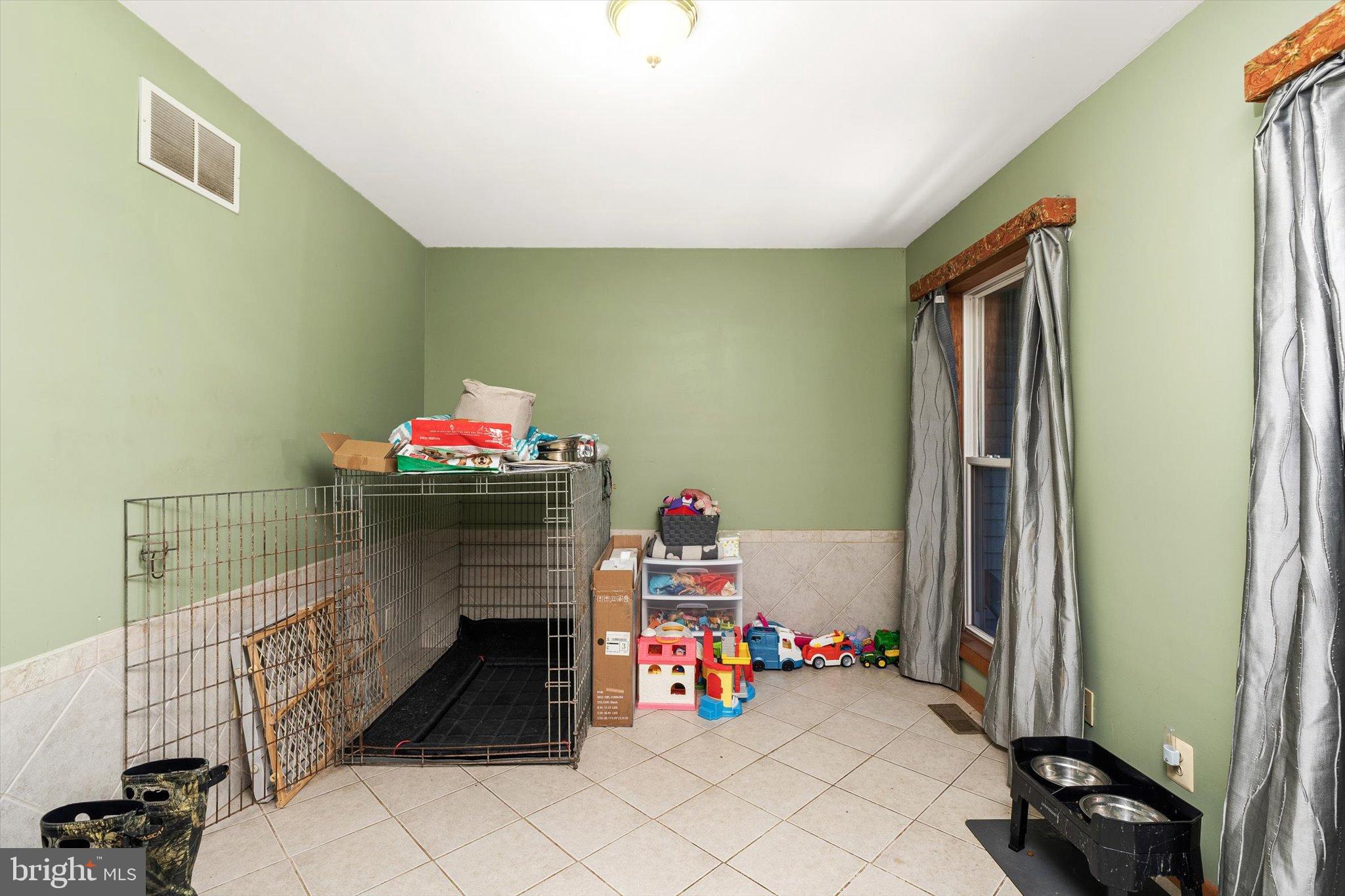 36 Allens Road Hightstown, NJ 08520 - Photo 14 of 43 a children room with toys and a fireplace