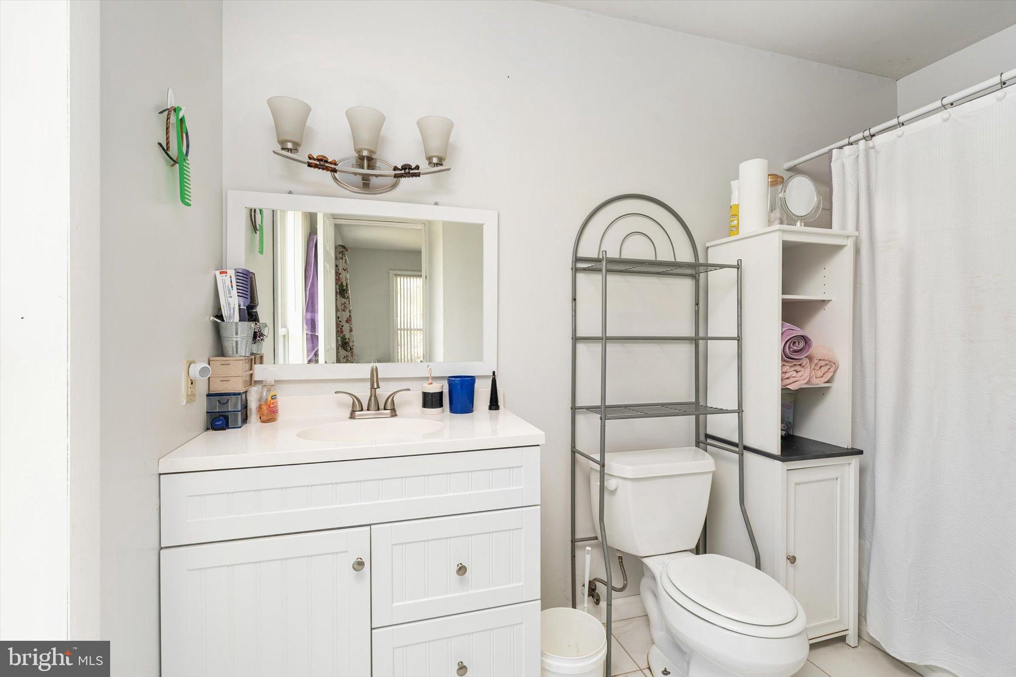 36 Allens Road Hightstown, NJ 08520 - Photo 17 of 43 a bathroom with a granite countertop toilet sink and mirror