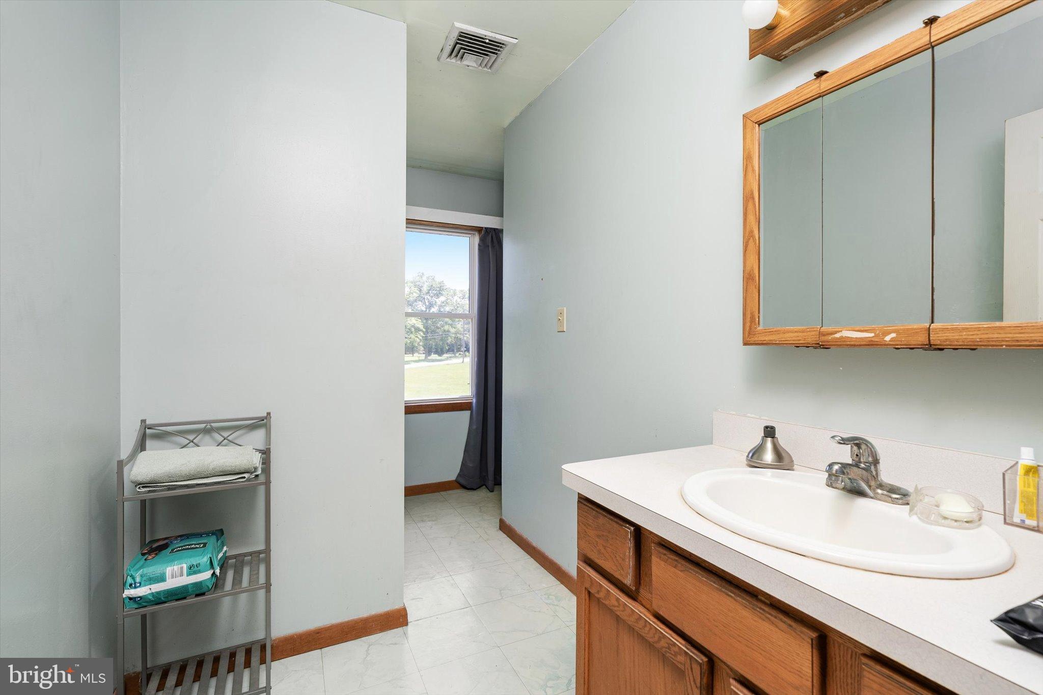 36 Allens Road Hightstown, NJ 08520 - Photo 26 of 43 a utility room with sink dryer and washer
