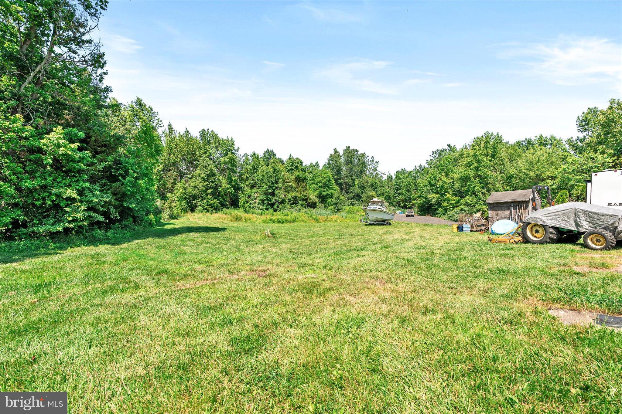 36 Allens Road Hightstown, NJ 08520 - Photo 31 of 43 a backyard of a house with table and chairs