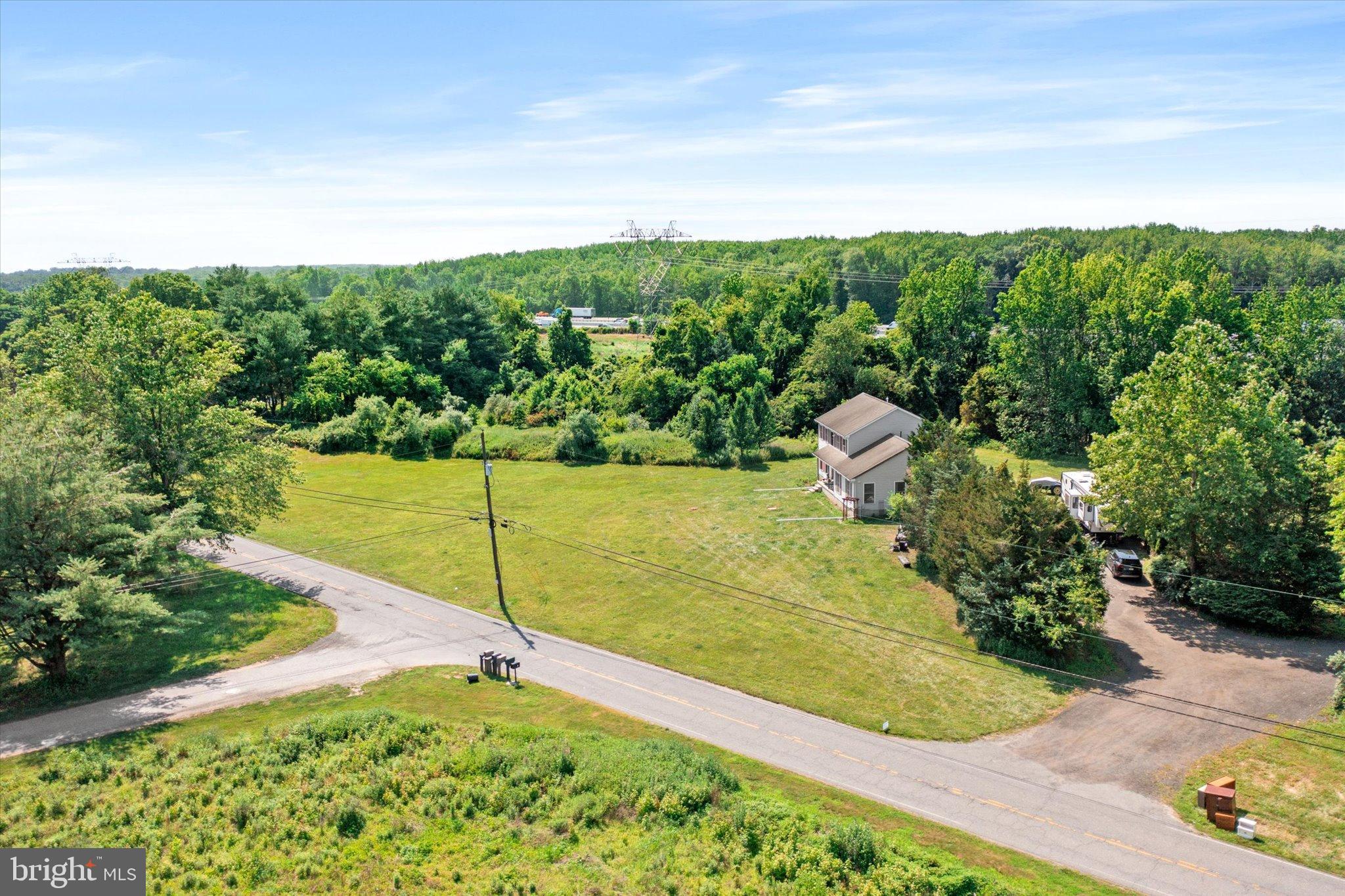 36 Allens Road Hightstown, NJ 08520 - Photo 34 of 43 a view of a garden with a building in the background
