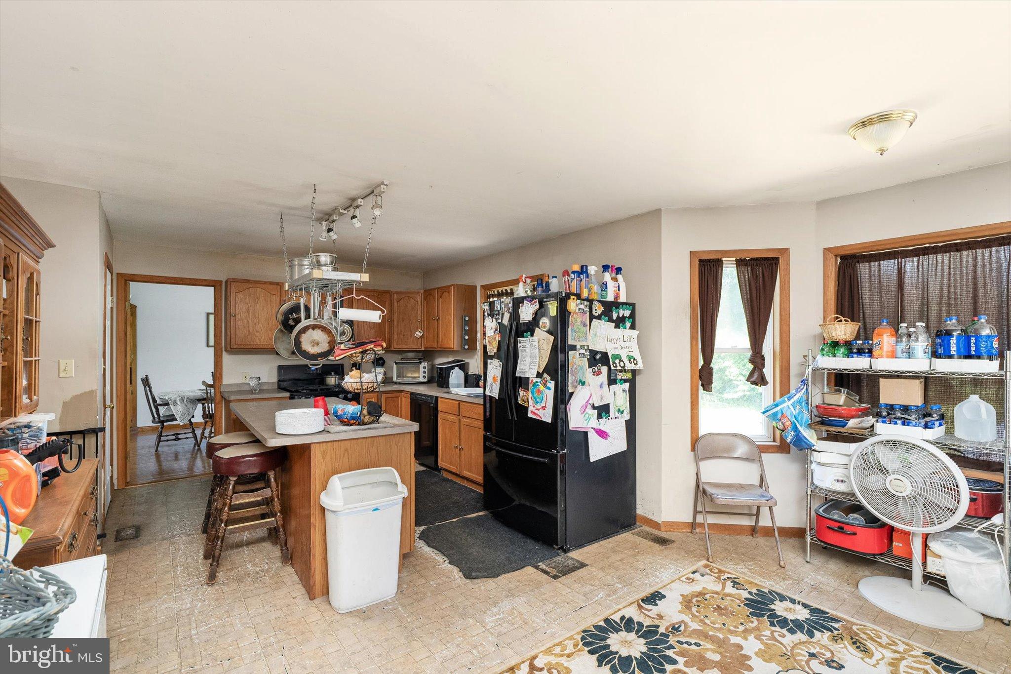 36 Allens Road Hightstown, NJ 08520 - Photo 8 of 43 a living room with lots of furniture and clutter