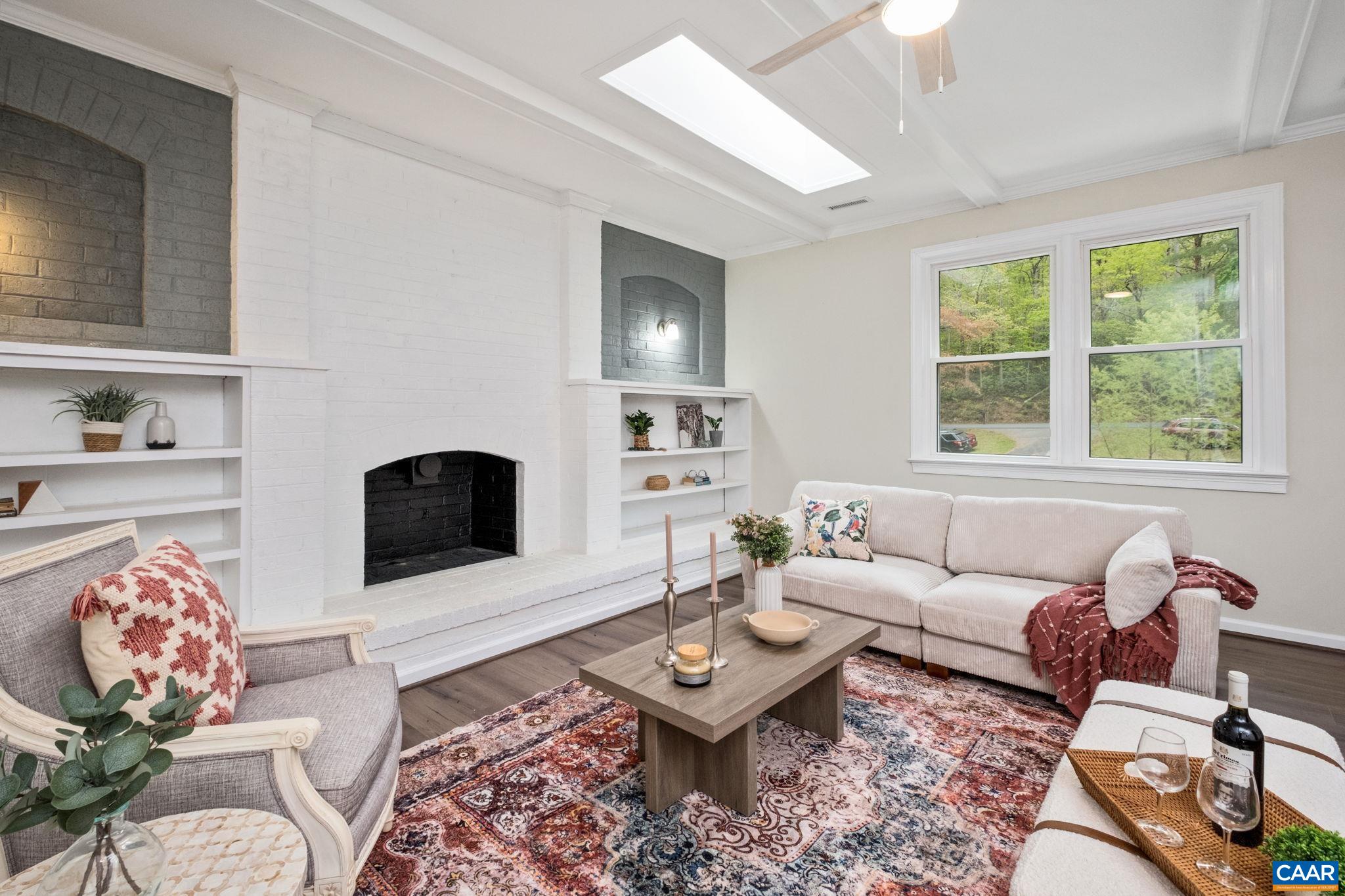 1680 Craigs Store Road Afton, VA 22920 - Photo 20 of 57 a living room with furniture a rug and a fireplace
