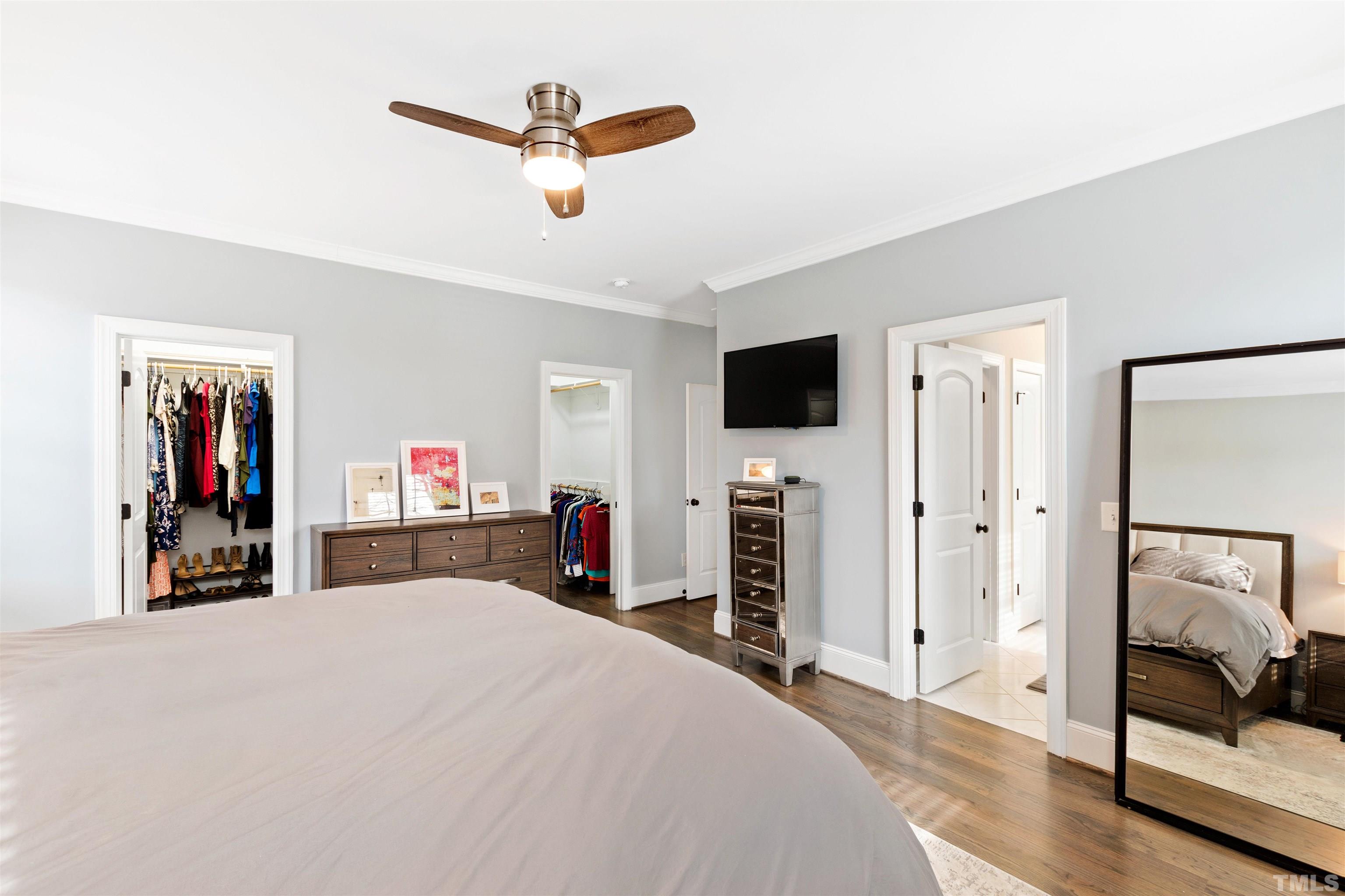 2005 Carroll Drive Raleigh, NC 27608 - Photo 25 of 52 a bed room with a bed and a flat screen tv