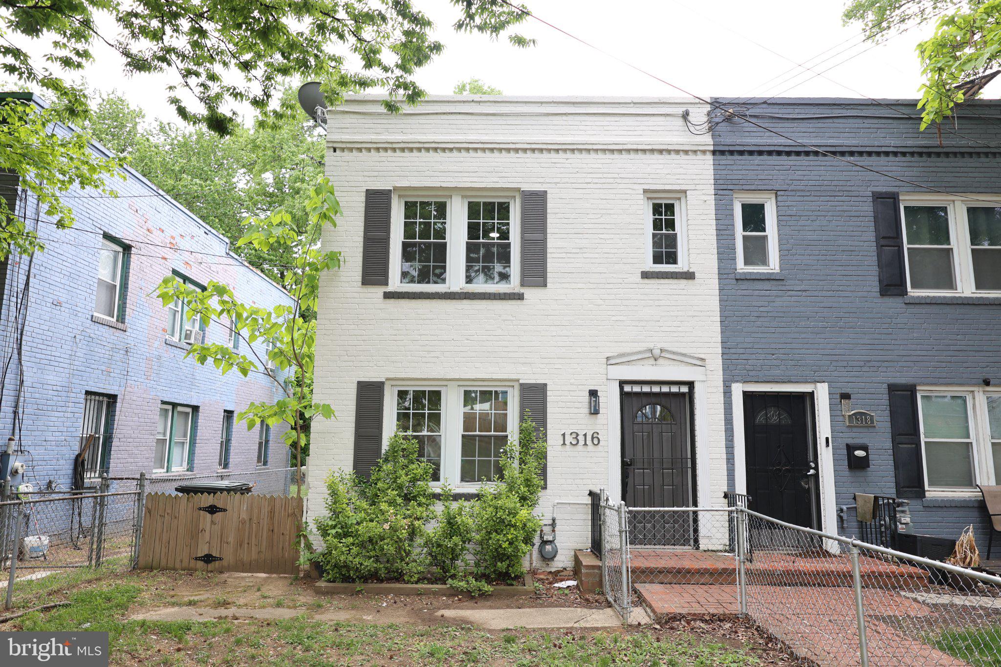 1316 Eastern Avenue Northeast Washington, DC 20019 - Photo 1 of 31 a front view of a house with a yard