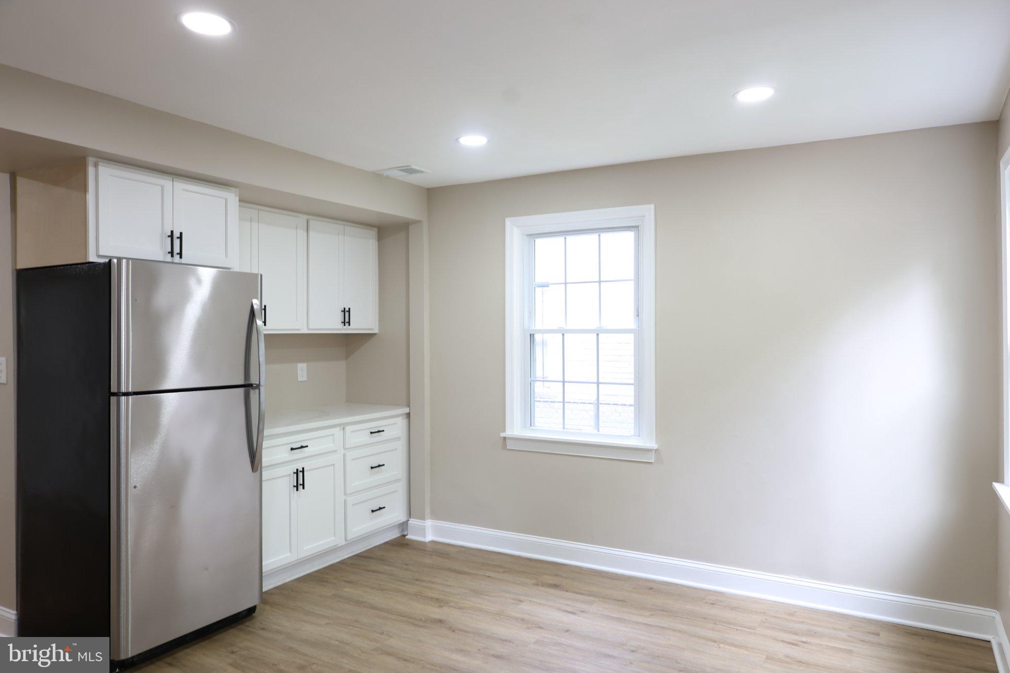 1316 Eastern Avenue Northeast Washington, DC 20019 - Photo 11 of 31 a kitchen with stainless steel appliances a refrigerator sink and cabinets
