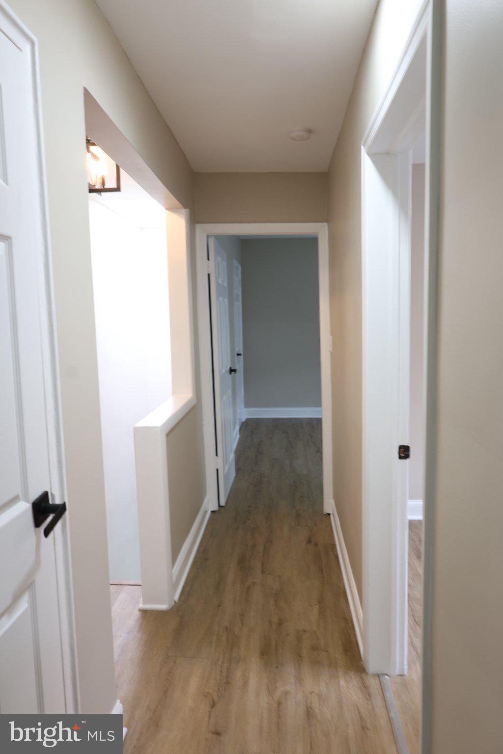 1316 Eastern Avenue Northeast Washington, DC 20019 - Photo 16 of 31 a view of a hallway with wooden floor and staircase