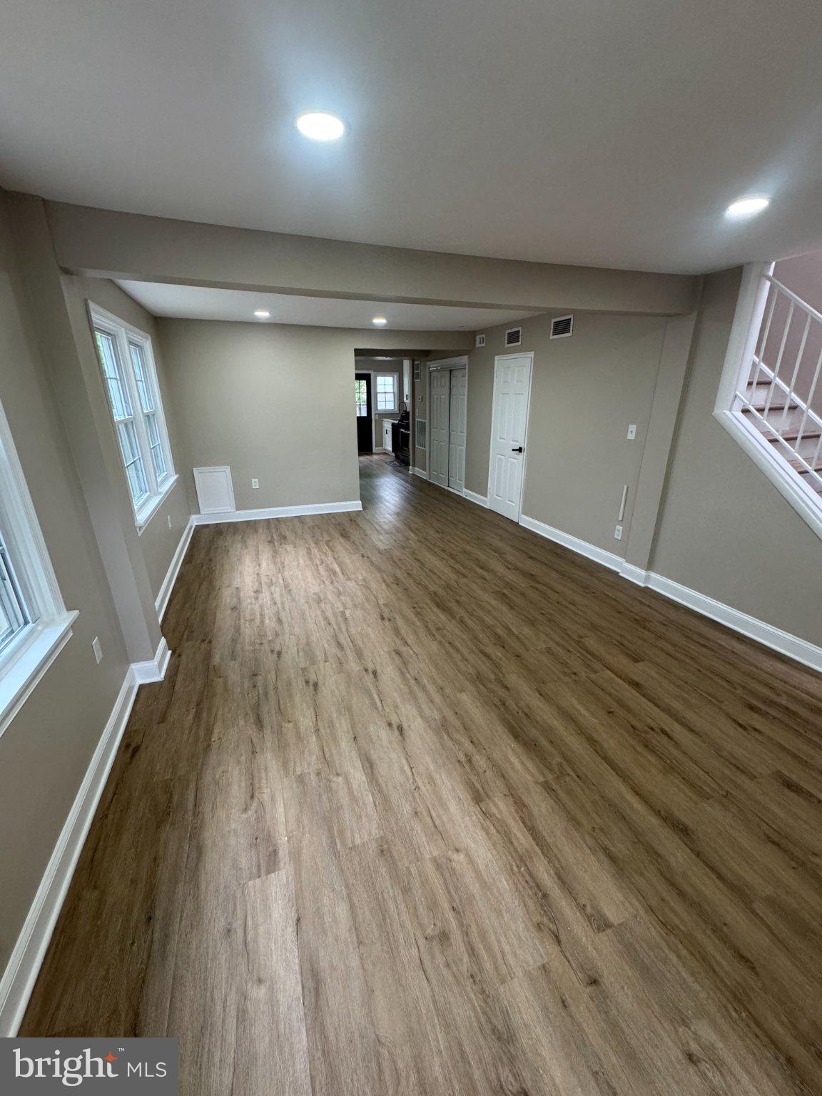 1316 Eastern Avenue Northeast Washington, DC 20019 - Photo 2 of 31 wooden floor in an empty room with a window