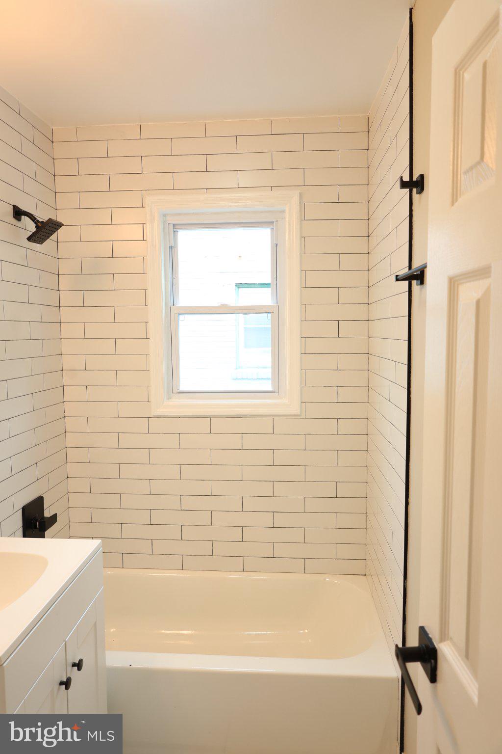 1316 Eastern Avenue Northeast Washington, DC 20019 - Photo 24 of 31 a bathroom with a bathtub and a shower