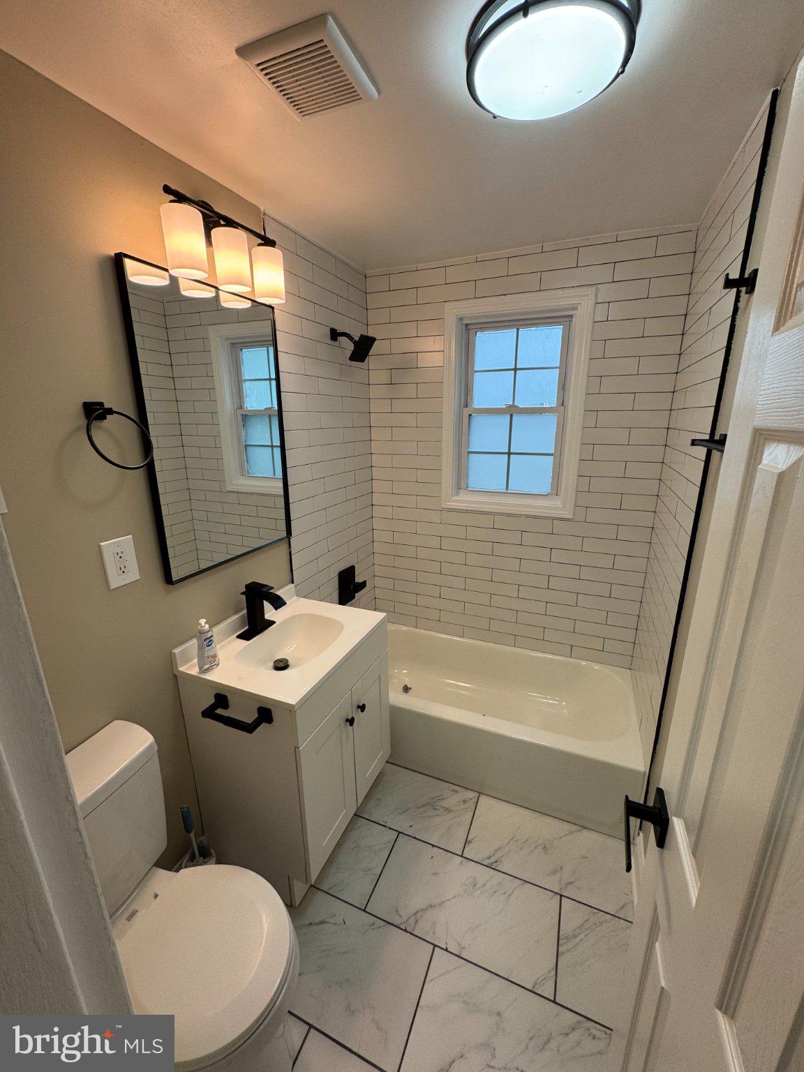 1316 Eastern Avenue Northeast Washington, DC 20019 - Photo 7 of 31 a bathroom with a sink toilet and tub