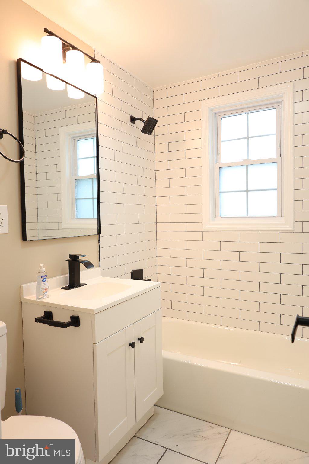1316 Eastern Avenue Northeast Washington, DC 20019 - Photo 8 of 31 a bathroom with a sink and a mirror