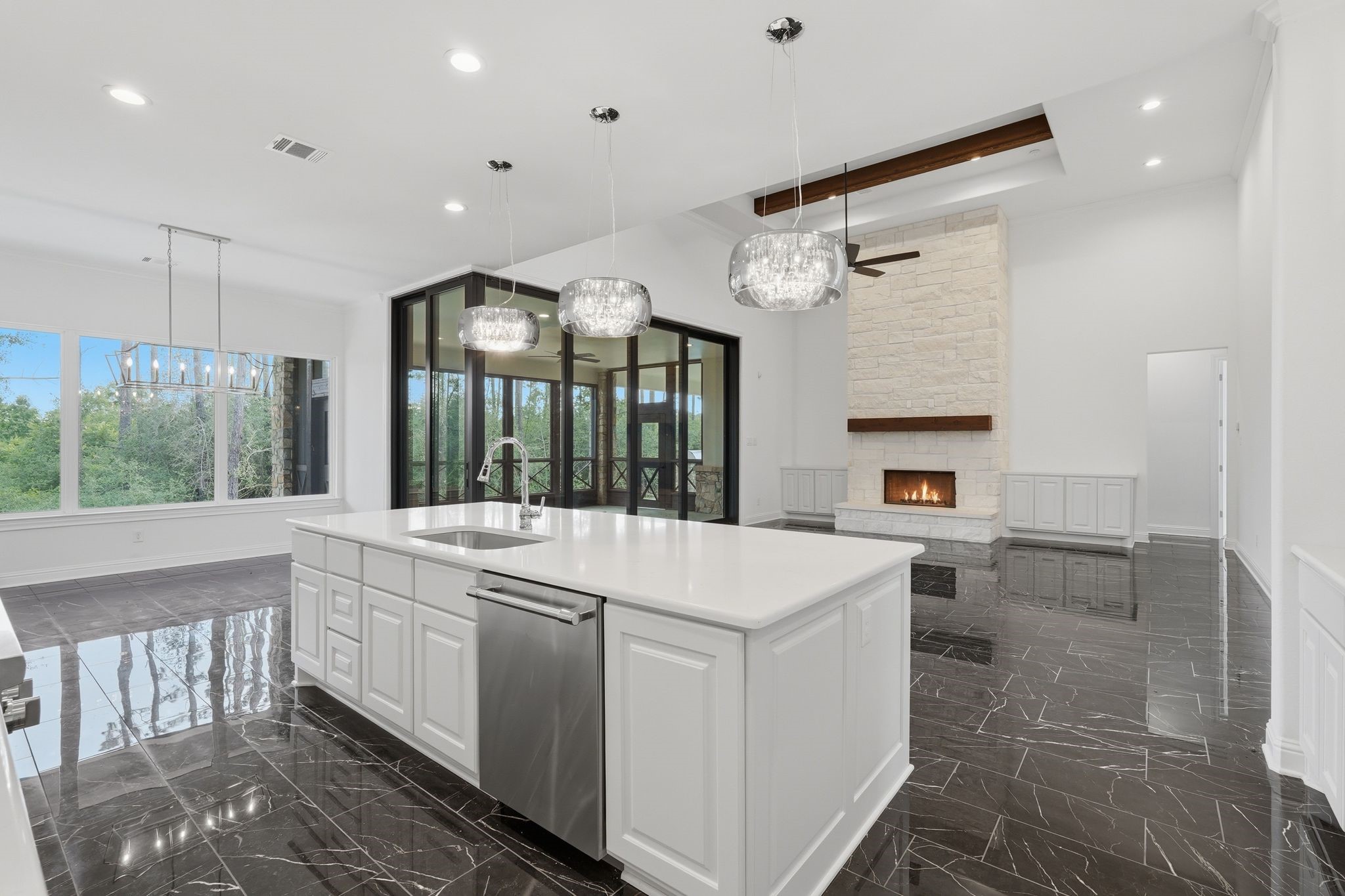 16081 Forest Mill Road Willis, TX 77378 - Photo 12 of 37 An entertainers dream! The gourmet kitchen flows effortlessly into the family room and outdoor living spaces.