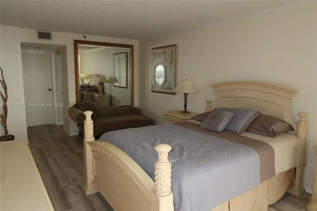 a bedroom with bed and window