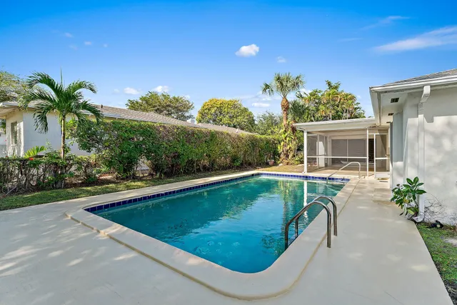 a view of a swimming pool with a patio