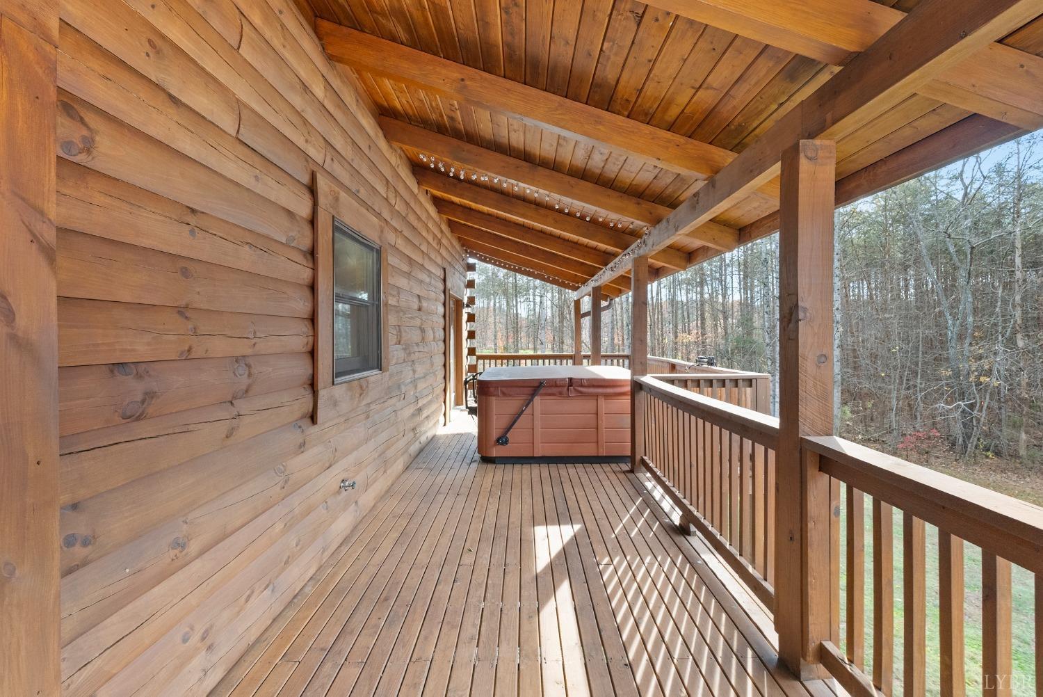 1069 Vineyard Road Spout Spring, VA 24538 - Photo 35 of 60 a view of a balcony with wooden floor