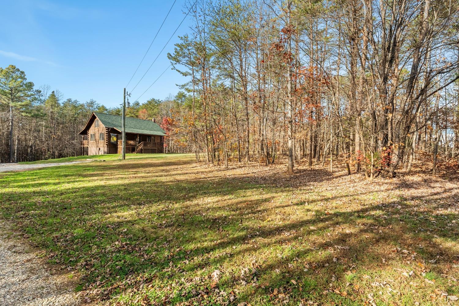 1069 Vineyard Road Spout Spring, VA 24538 - Photo 50 of 60 a view of swimming pool with outdoor seating and covered with trees