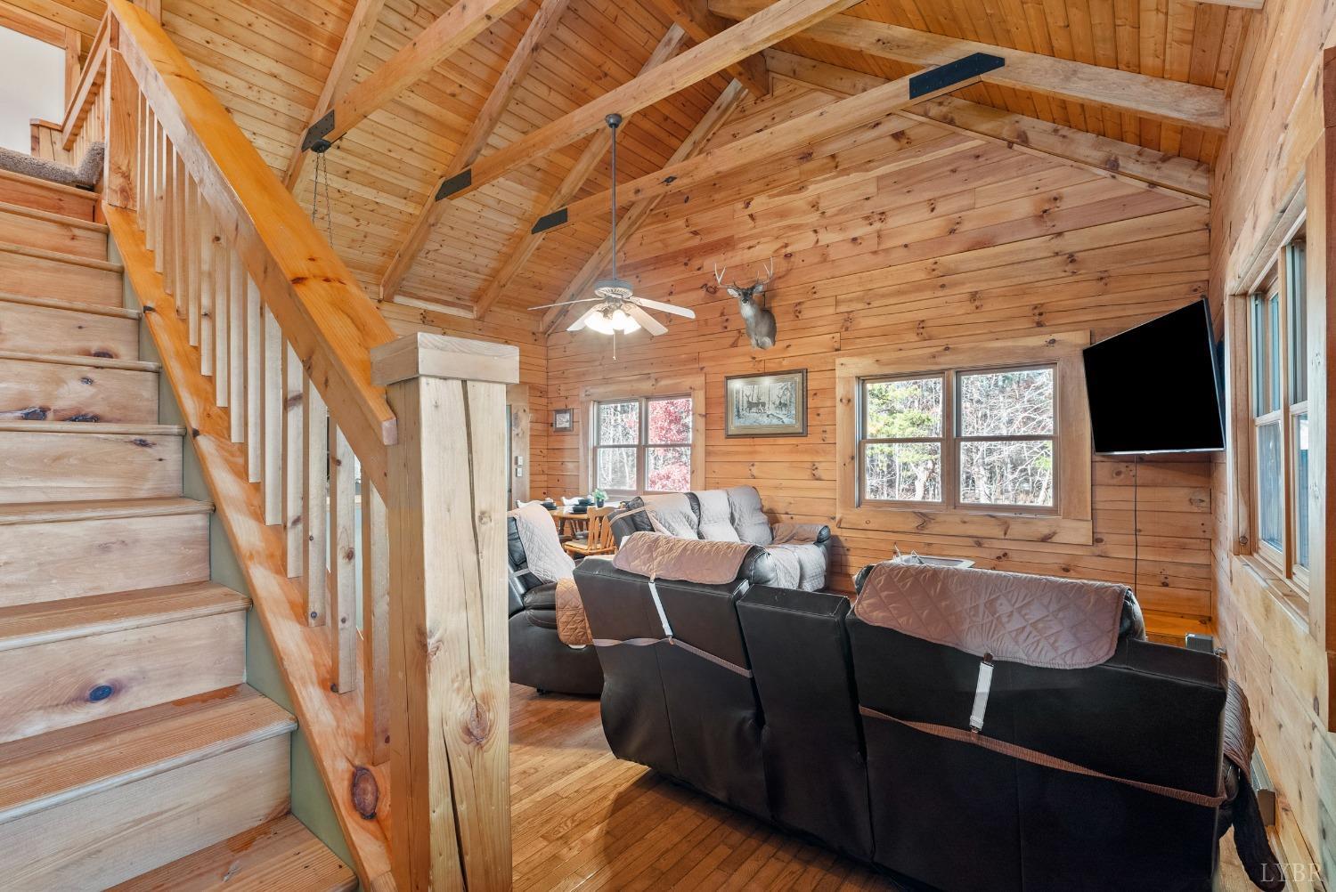 1069 Vineyard Road Spout Spring, VA 24538 - Photo 6 of 60 a living room with furniture fireplace and flat screen tv