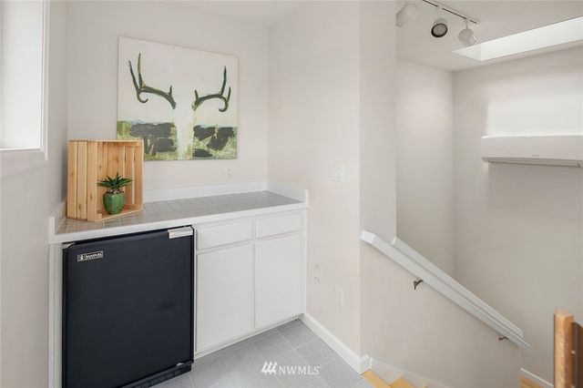 a living room with furniture rug and window
