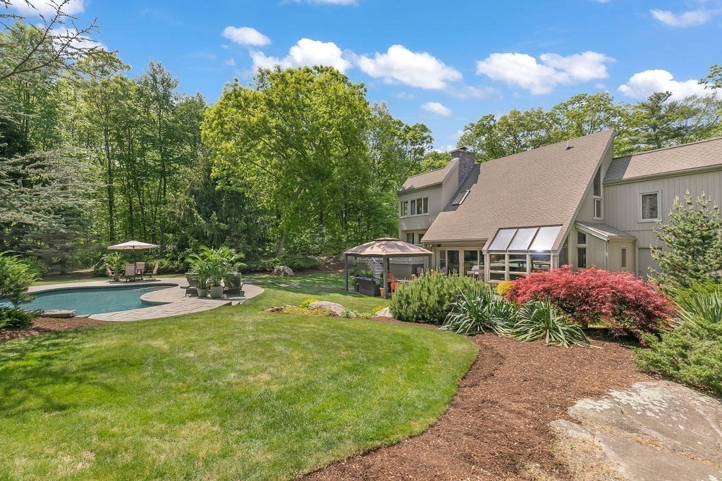 23 Crockett Road Upton, MA 01757 - Photo 39 of 42 a view of a house with garden and a yard