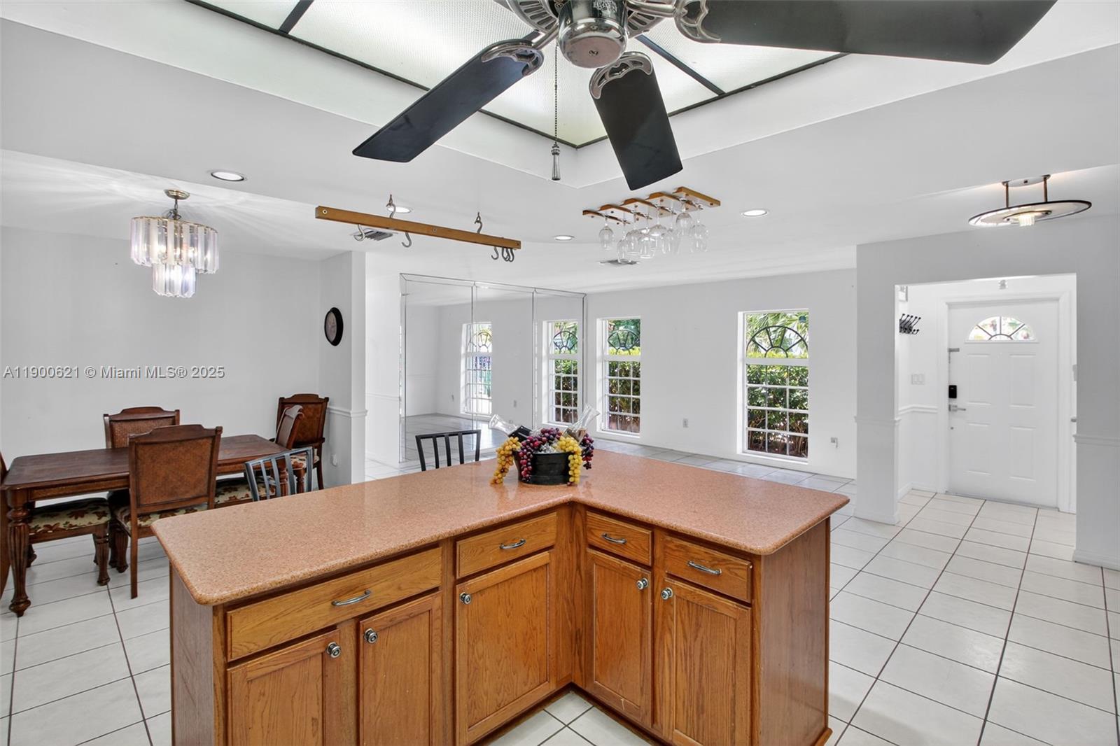 15403 Southwest 107th Court Miami, FL 33157 - Photo 11 of 48 a kitchen with a sink a counter space and chandelier