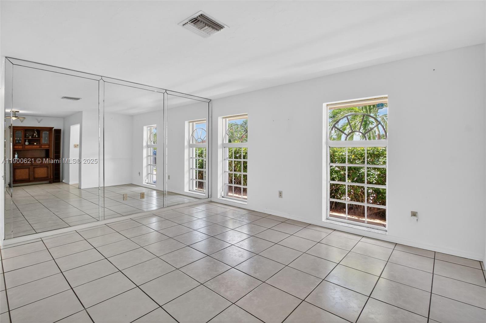15403 Southwest 107th Court Miami, FL 33157 - Photo 12 of 48 a view of an empty room and window