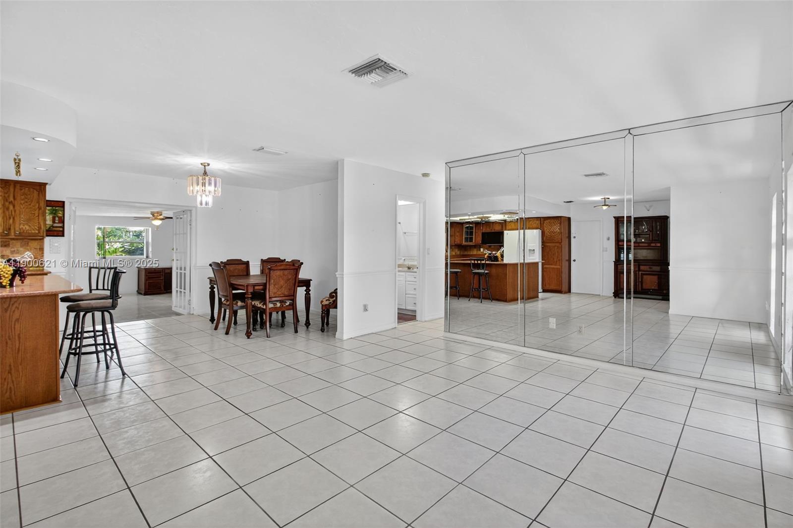 15403 Southwest 107th Court Miami, FL 33157 - Photo 14 of 48 a view of a livingroom with furniture and a kitchen
