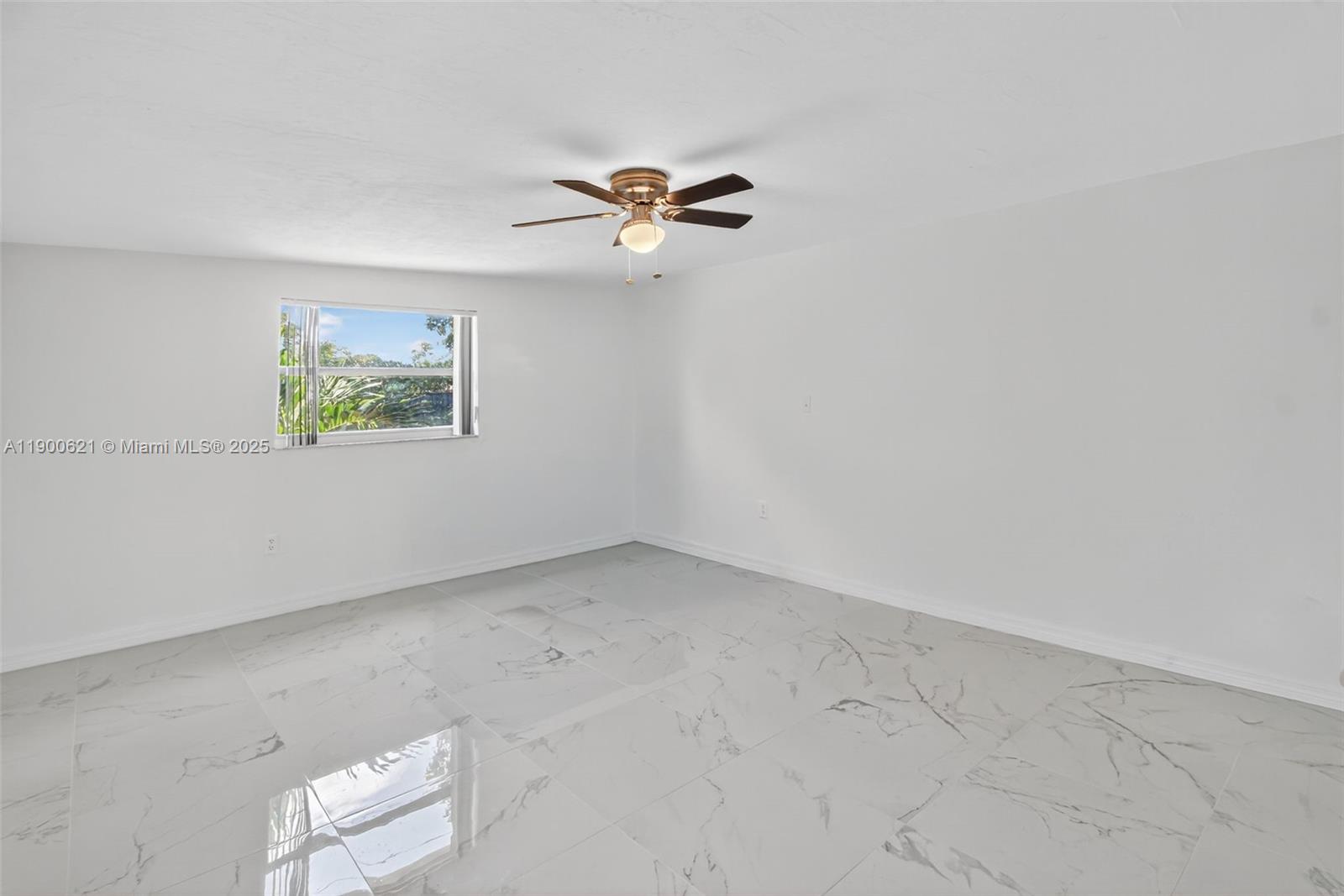 15403 Southwest 107th Court Miami, FL 33157 - Photo 18 of 48 an empty room with windows and fan