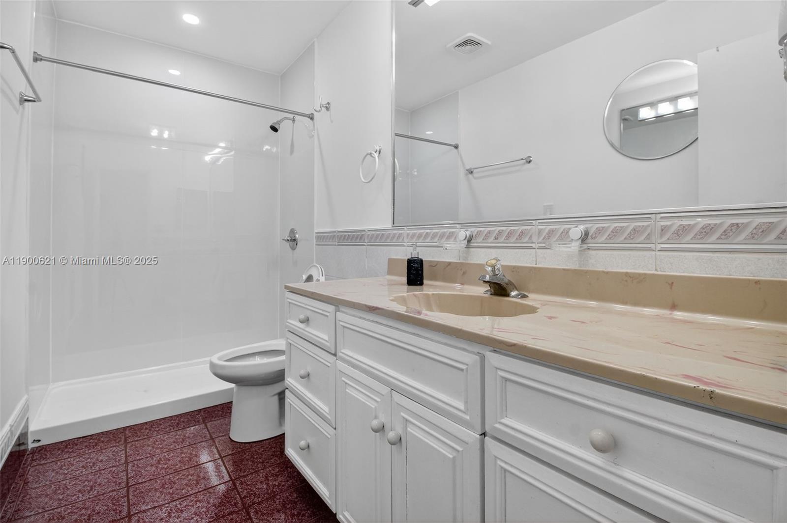 15403 Southwest 107th Court Miami, FL 33157 - Photo 21 of 48 a bathroom with a sink a toilet and shower