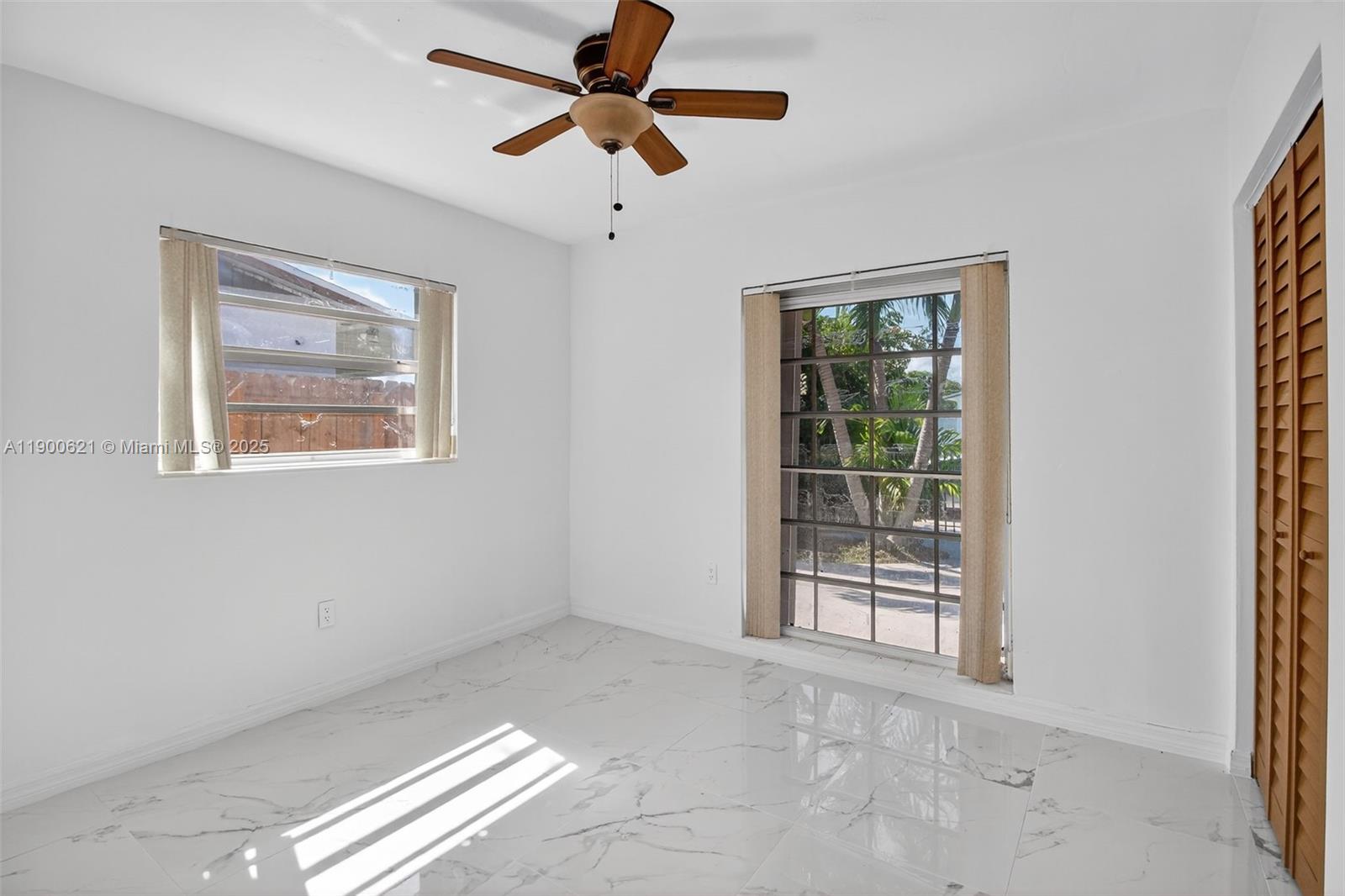 15403 Southwest 107th Court Miami, FL 33157 - Photo 31 of 48 a view of an empty room with a window