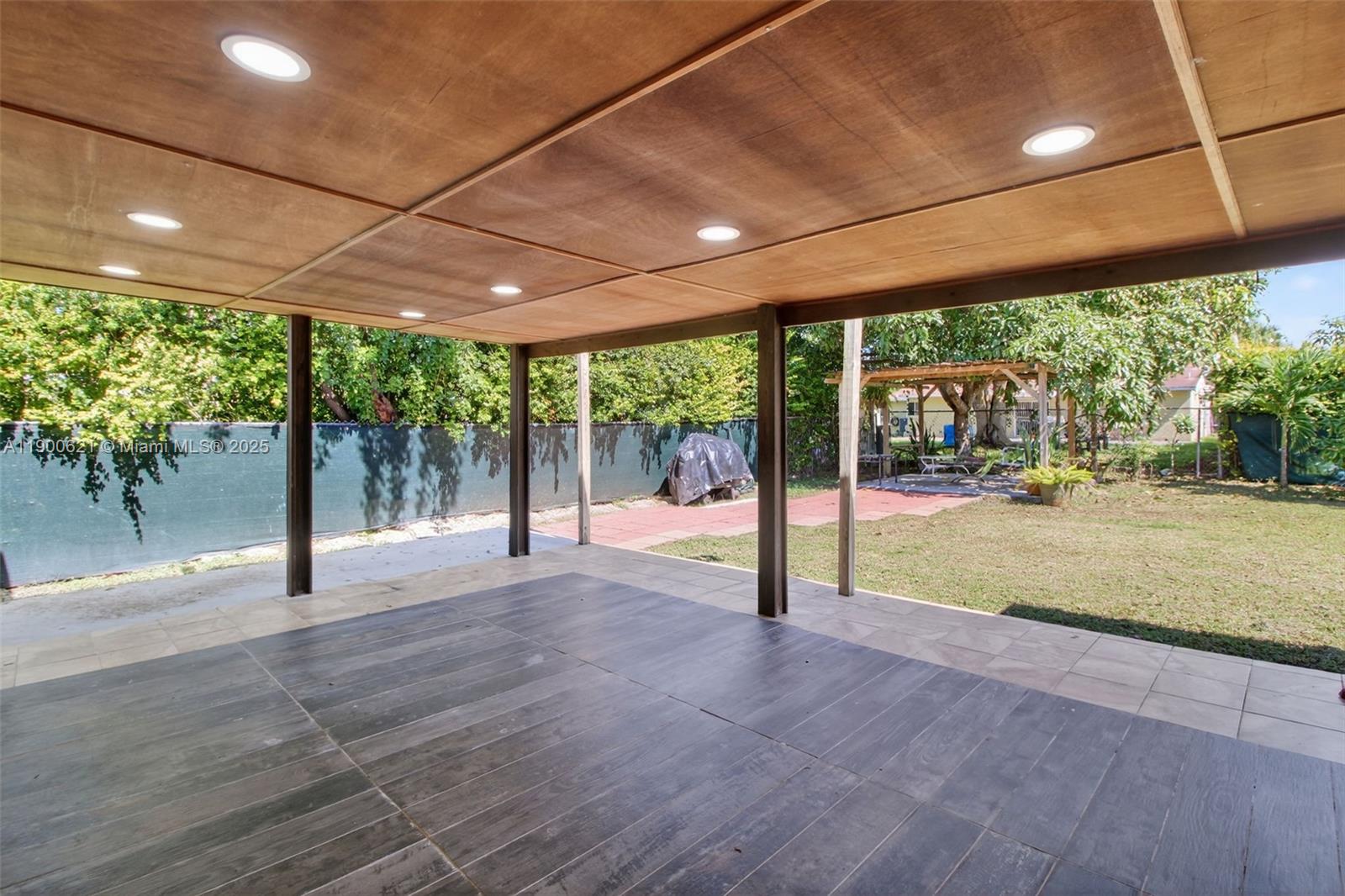 15403 Southwest 107th Court Miami, FL 33157 - Photo 34 of 48 a swimming pool with large trees in front of it