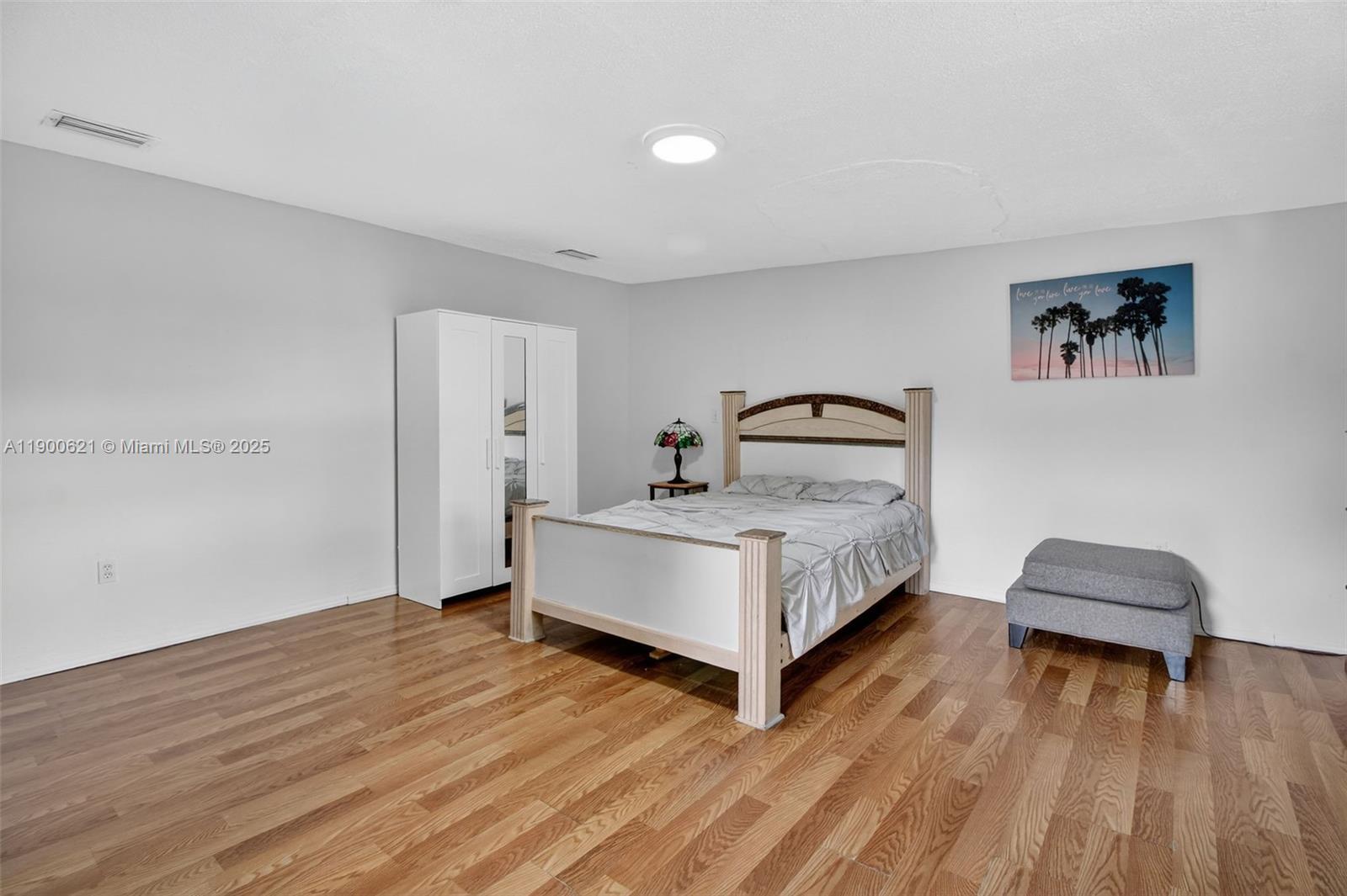 15403 Southwest 107th Court Miami, FL 33157 - Photo 43 of 48 a bedroom with a bed and a table