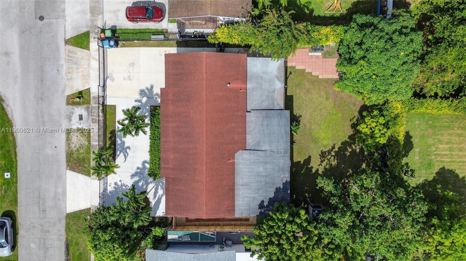 15403 Southwest 107th Court Miami, FL 33157 - Photo 48 of 48 an aerial view of a house with a yard and garden