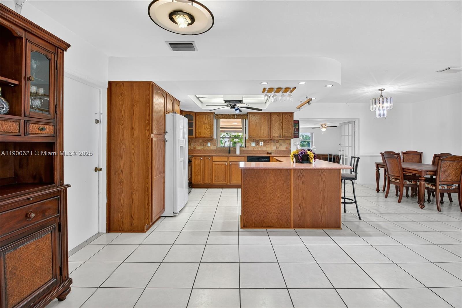 15403 Southwest 107th Court Miami, FL 33157 - Photo 8 of 48 a kitchen with stainless steel appliances granite countertop a refrigerator and a stove top oven