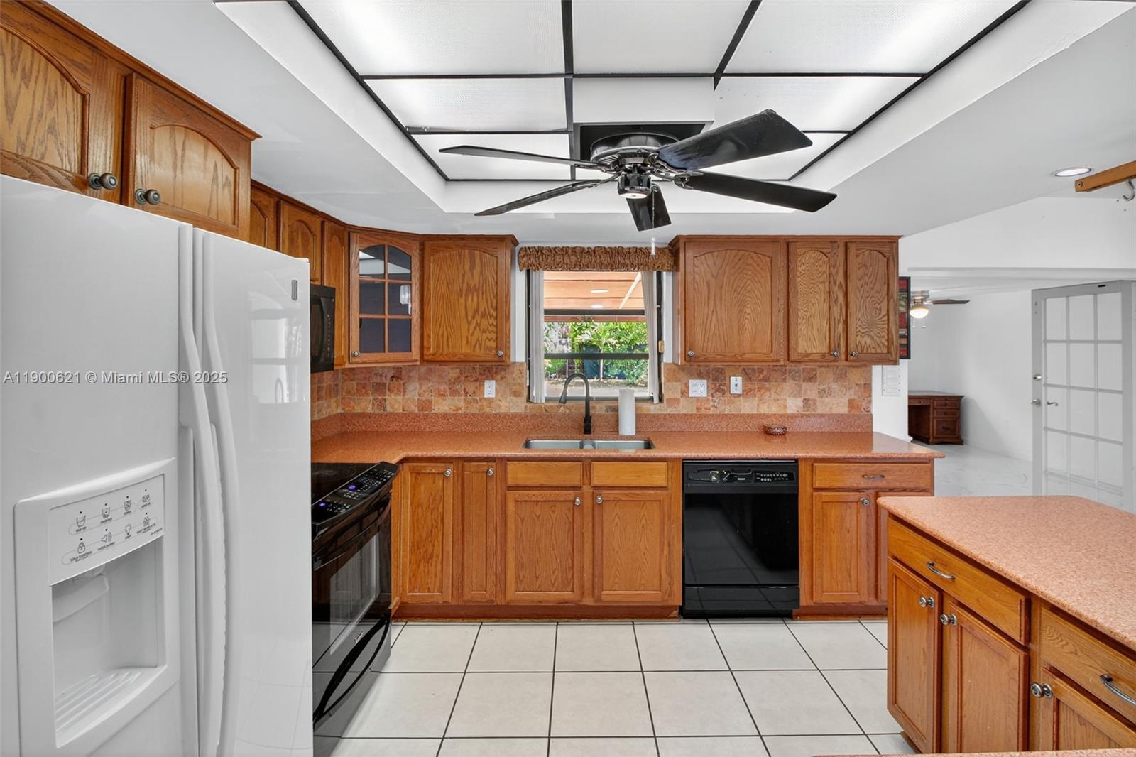15403 Southwest 107th Court Miami, FL 33157 - Photo 9 of 48 a kitchen with stainless steel appliances granite countertop a sink stove and refrigerator