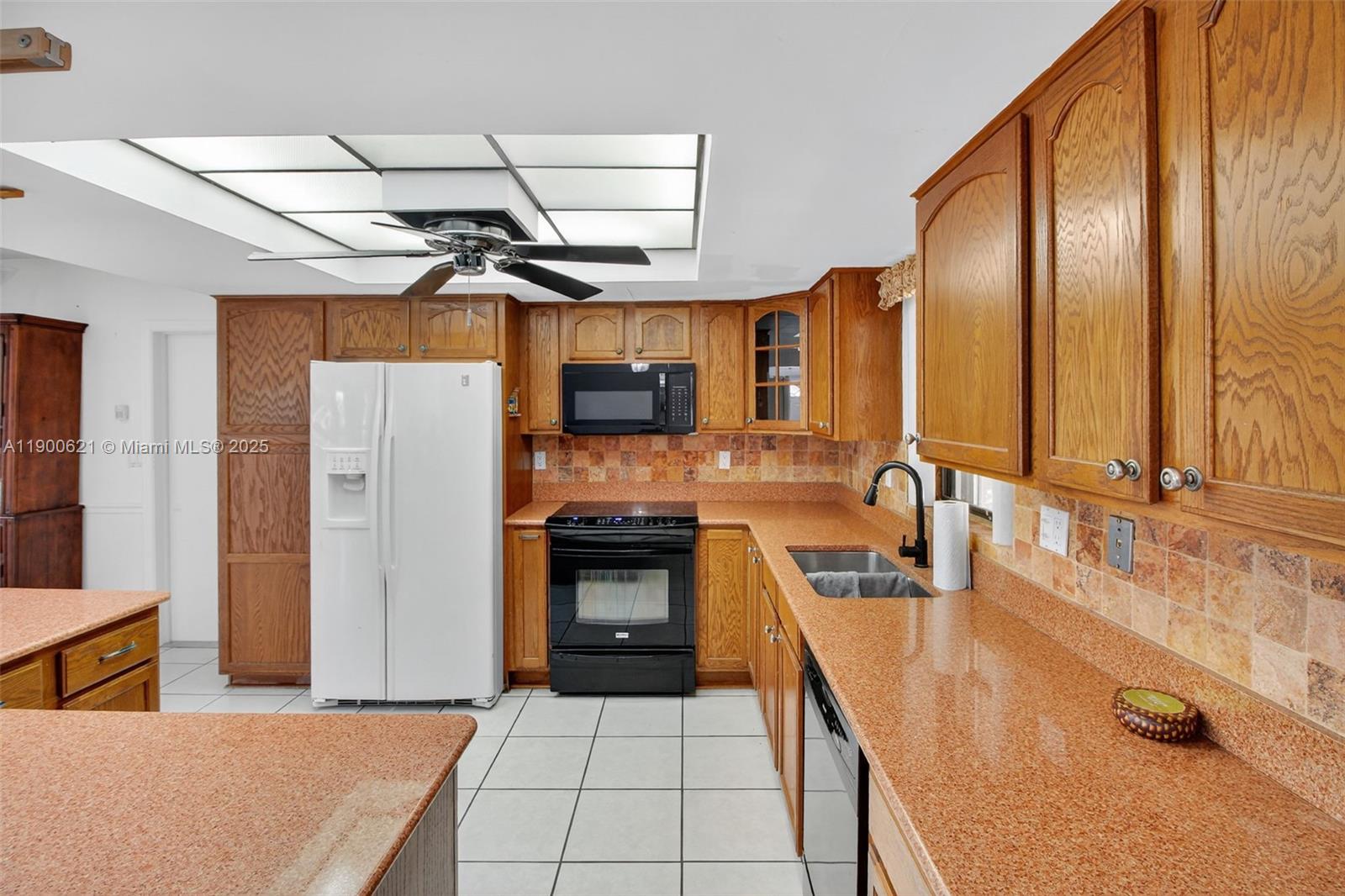 15403 Southwest 107th Court Miami, FL 33157 - Photo 10 of 48 a kitchen with stainless steel appliances a sink stove and refrigerator