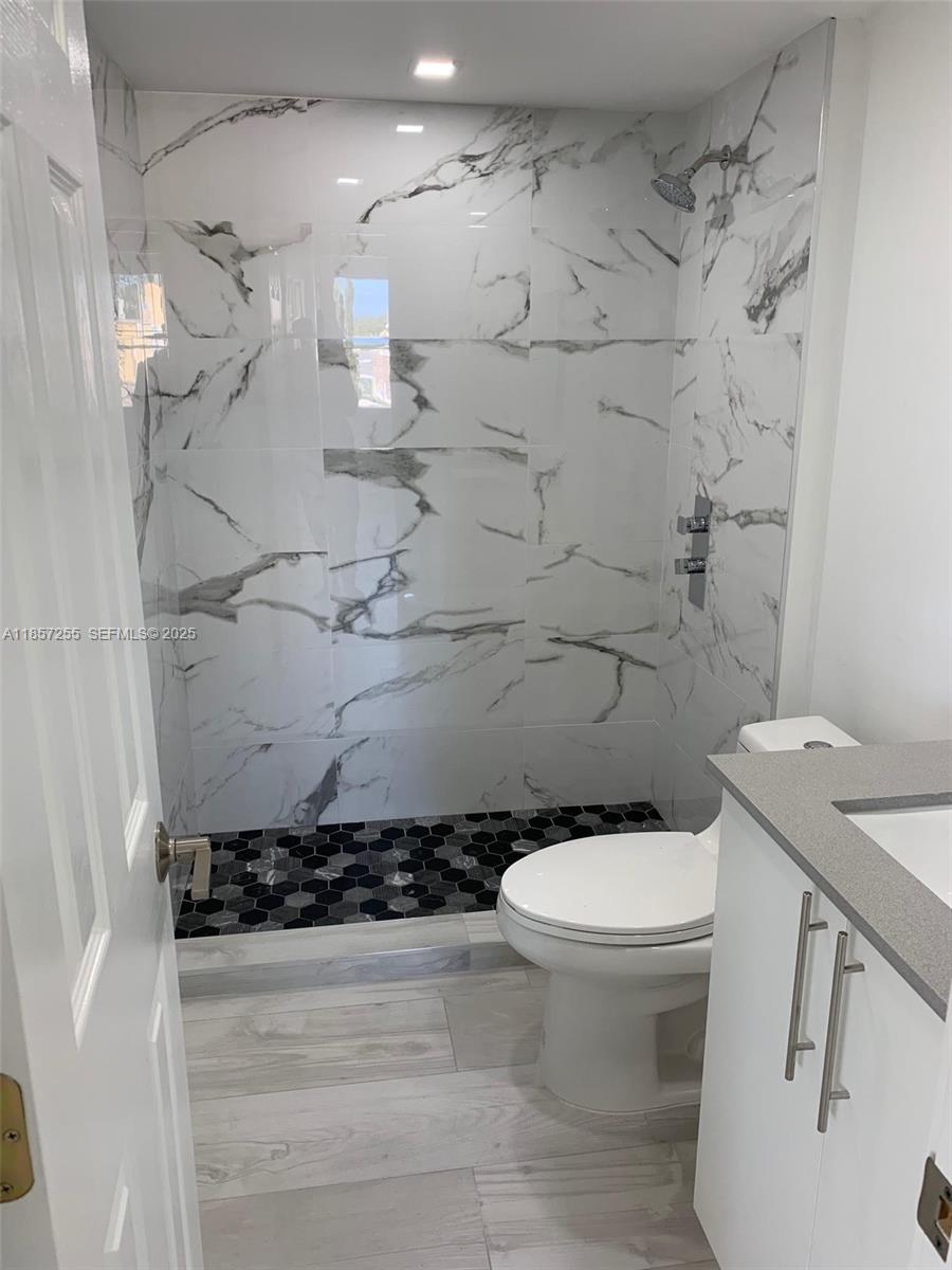 6825 Southwest 45th Lane, Unit 7 Miami, FL 33155 - Photo 15 of 30 a bathroom with a toilet and a shower
