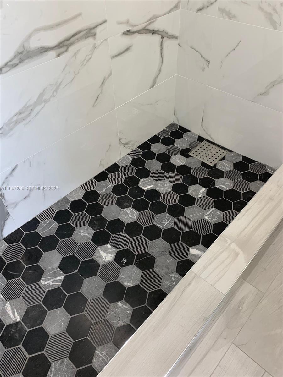 6825 Southwest 45th Lane, Unit 7 Miami, FL 33155 - Photo 16 of 30 a black and white checkered floor