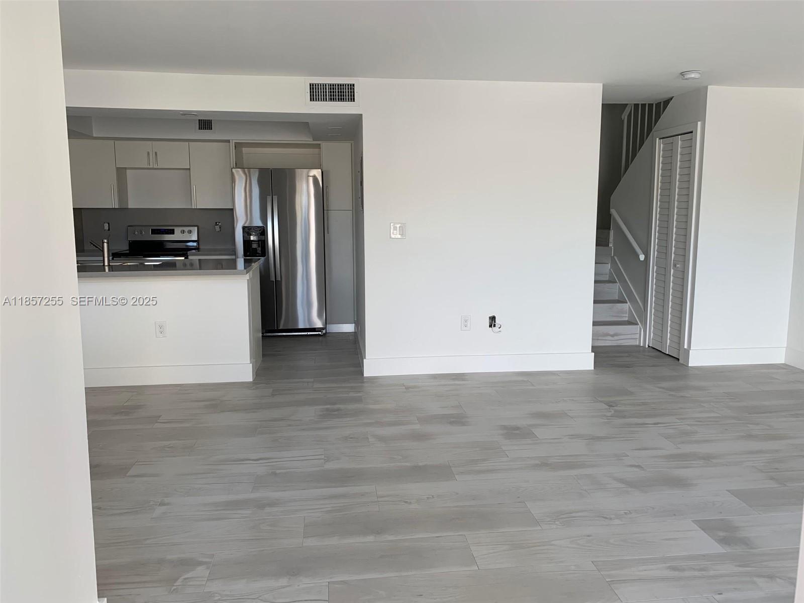 6825 Southwest 45th Lane, Unit 7 Miami, FL 33155 - Photo 3 of 30 a view of kitchen appliances and cabinets