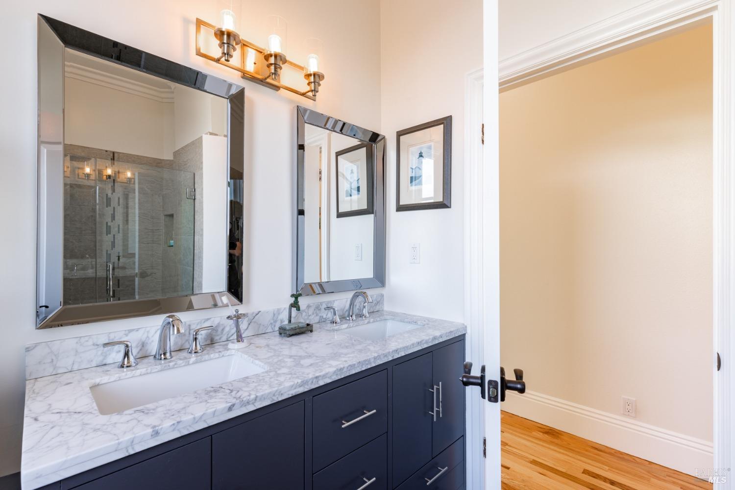 1730 Milton Road Napa, CA 94559 - Photo 59 of 77 a bathroom with a granite countertop sink and a mirror