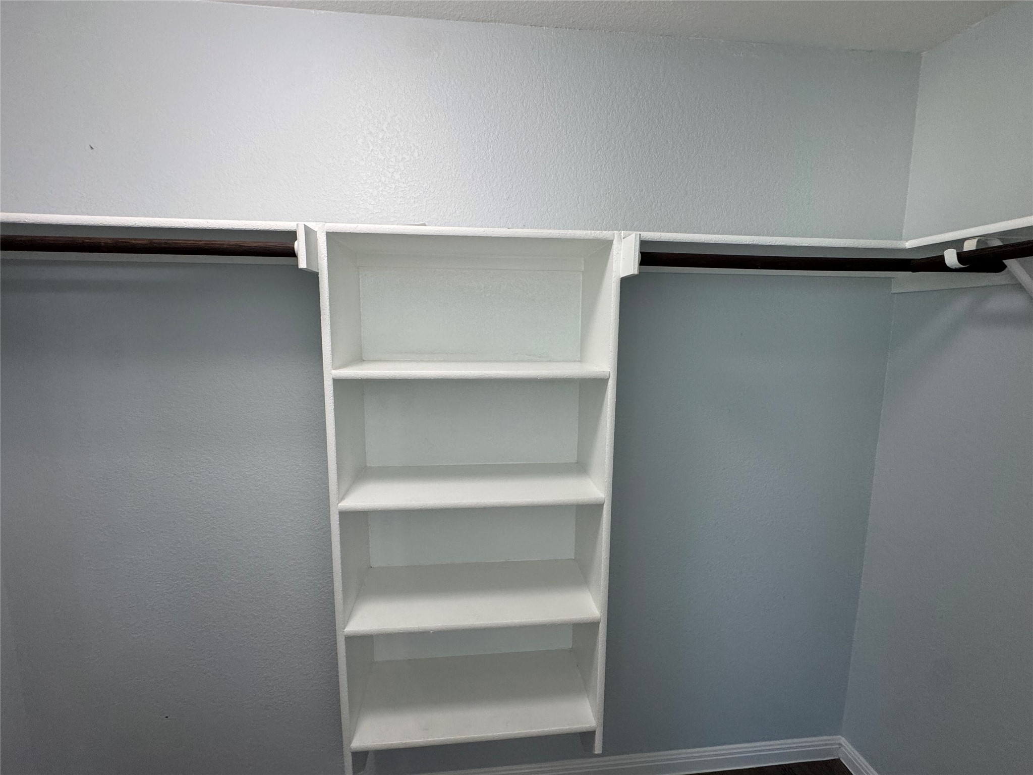 1520 Portchester Castle Path Pflugerville, TX 78660 - Photo 14 of 26 Functional closet space with built-in shelving offers smart storage solutions.