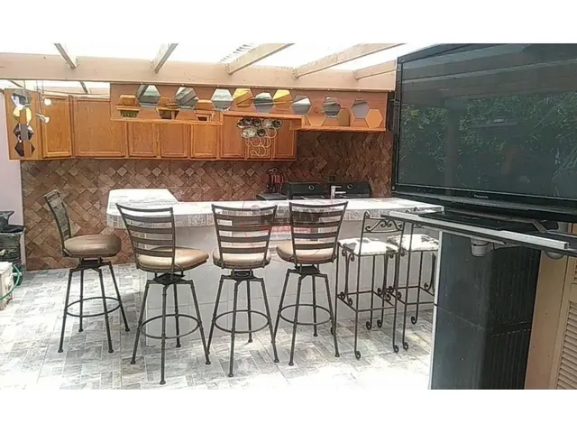 a view of a chairs and table in a patio