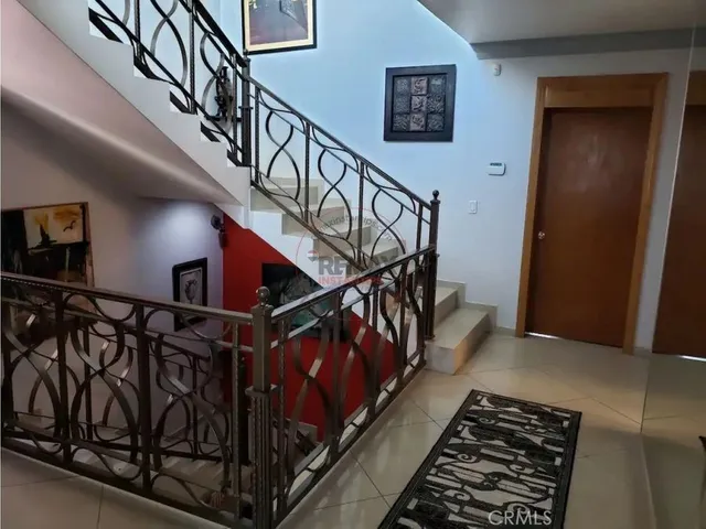 a bedroom with bed and window