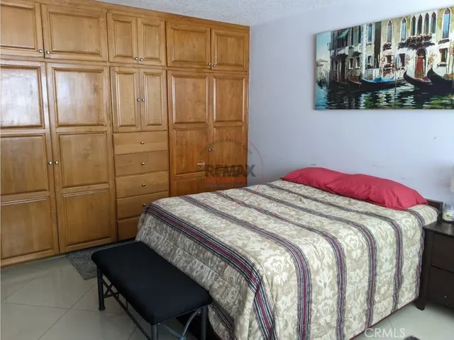 a view of a livingroom with furniture and a window