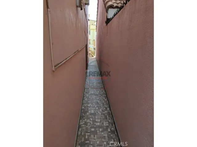 a view of a hallway with stairs