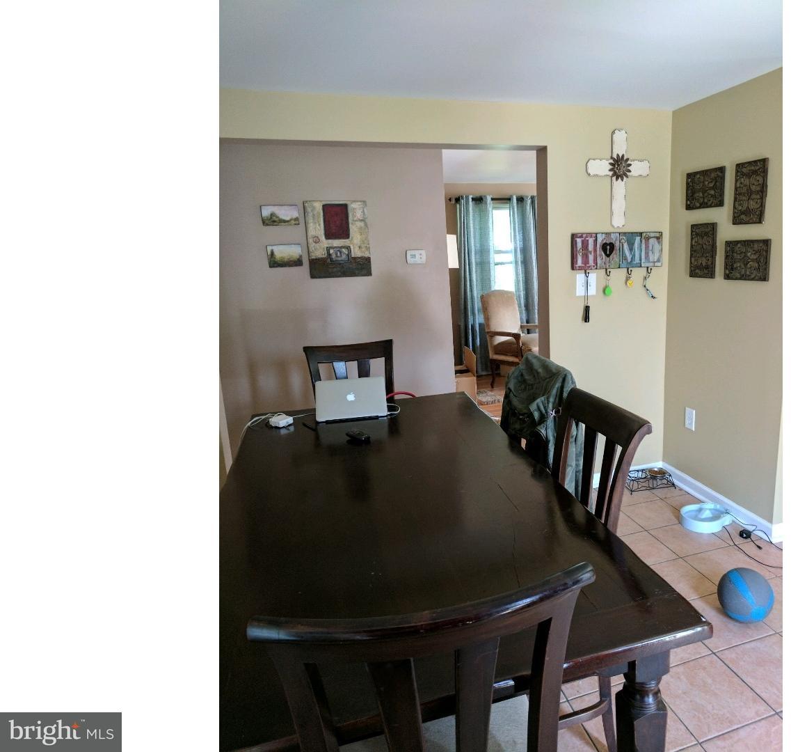 429 Nicholson Road Gloucester City, NJ 08030 - Photo 3 of 3 a living room with furniture and wooden floor