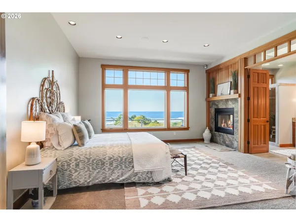 a bedroom with a bed and a fireplace