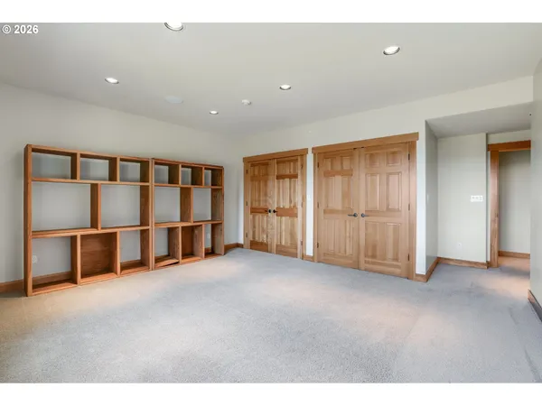 a view of an empty room with closet