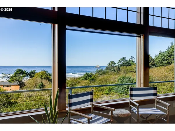 a view of a couple of benches with wooden floor
