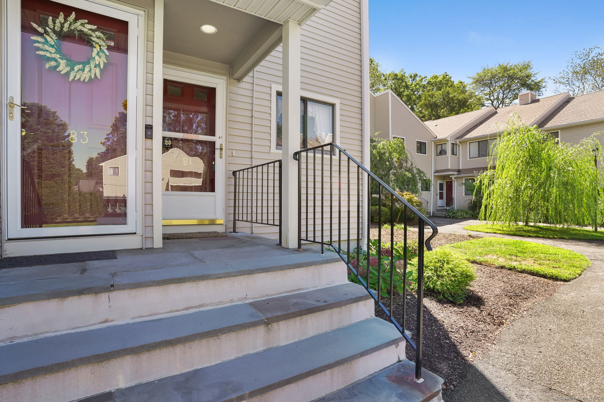 81 Lance Circle, Unit 81 Bridgeport, CT 06606 - Photo 1 of 24 a view of a house with a yard
